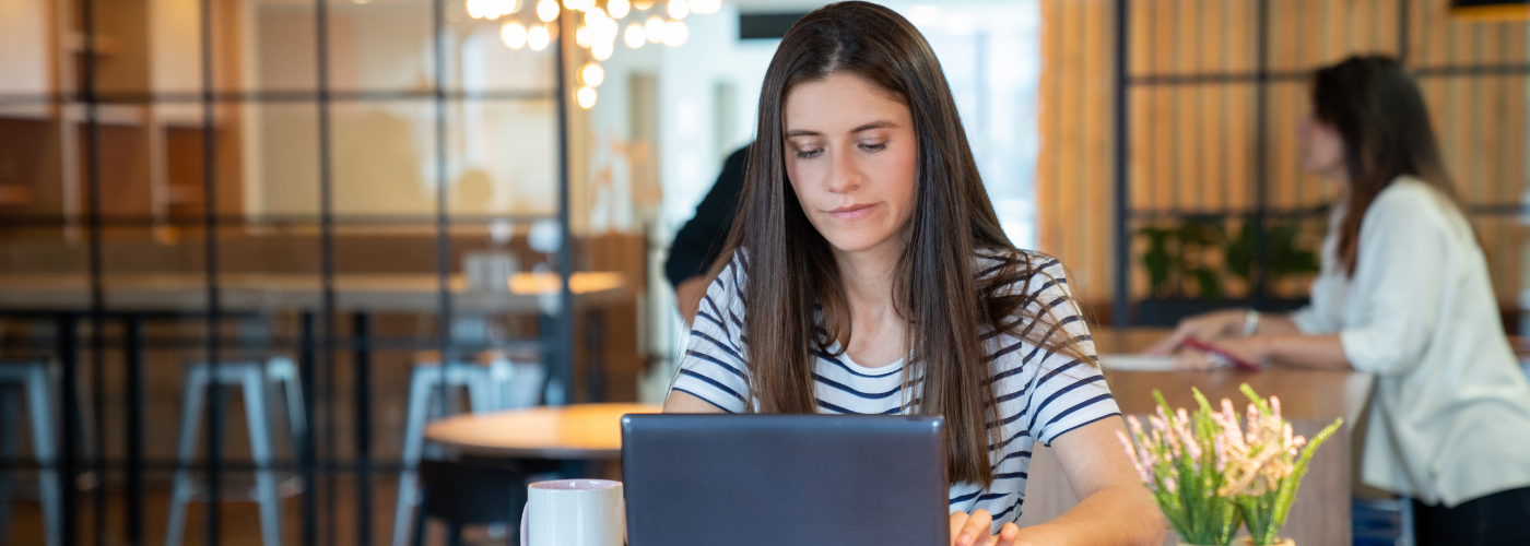 An unhappy, negative employee at her computer searching for her EAP An unhappy, negative employee at her computer searching for her EAP