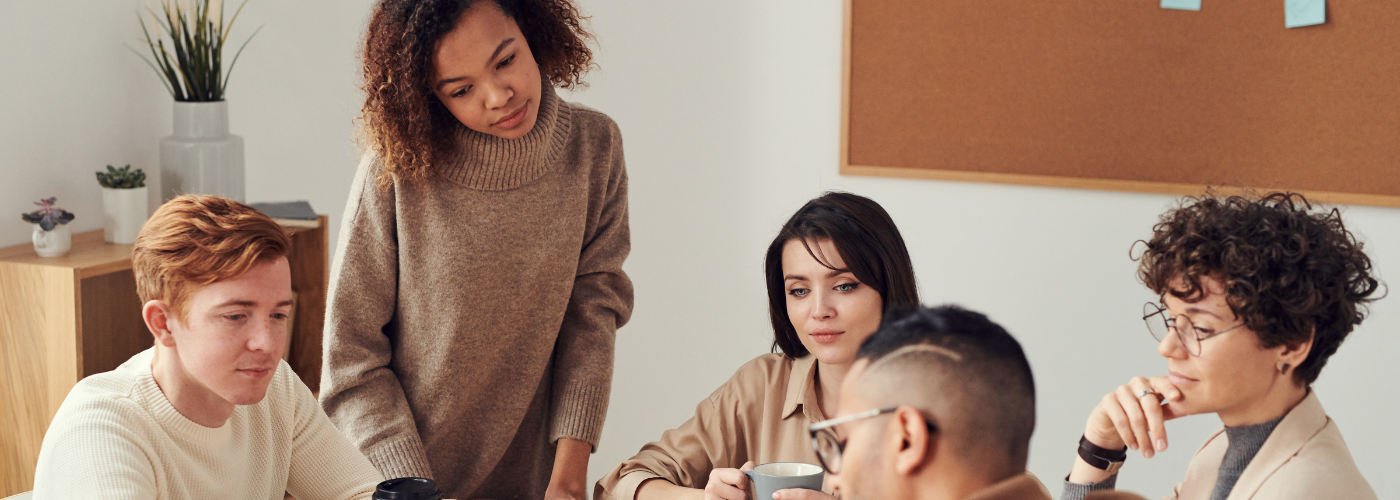 Employees collaborating and supporting each other during workplace changes